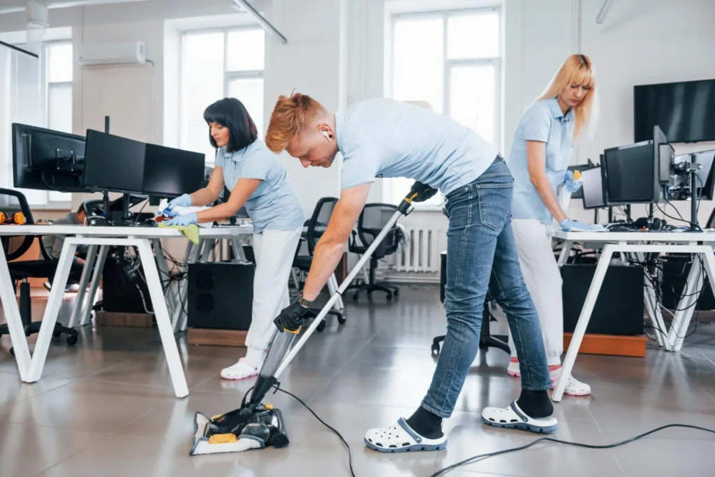 Commercial cleaning services team sanitizing a modern Fort Wayne office.